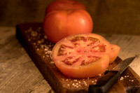 Sliced tomatoes on wood