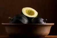 Gem squash placed in a brown bowl