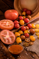 tomatoes spreading out on a wodden board