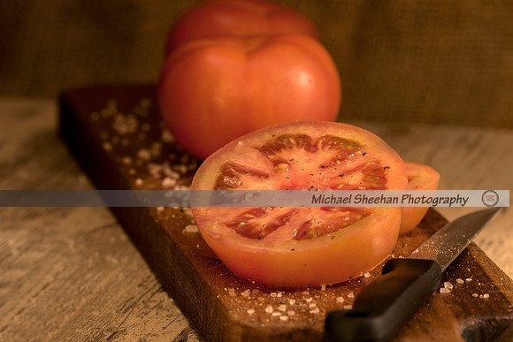 Sliced tomato on a wooden board