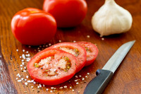 Tasty tomatoes on a wooden board