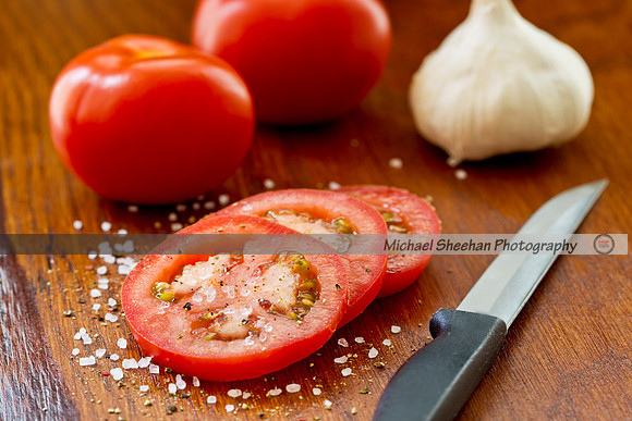 Tasty tomatoes on a wooden board